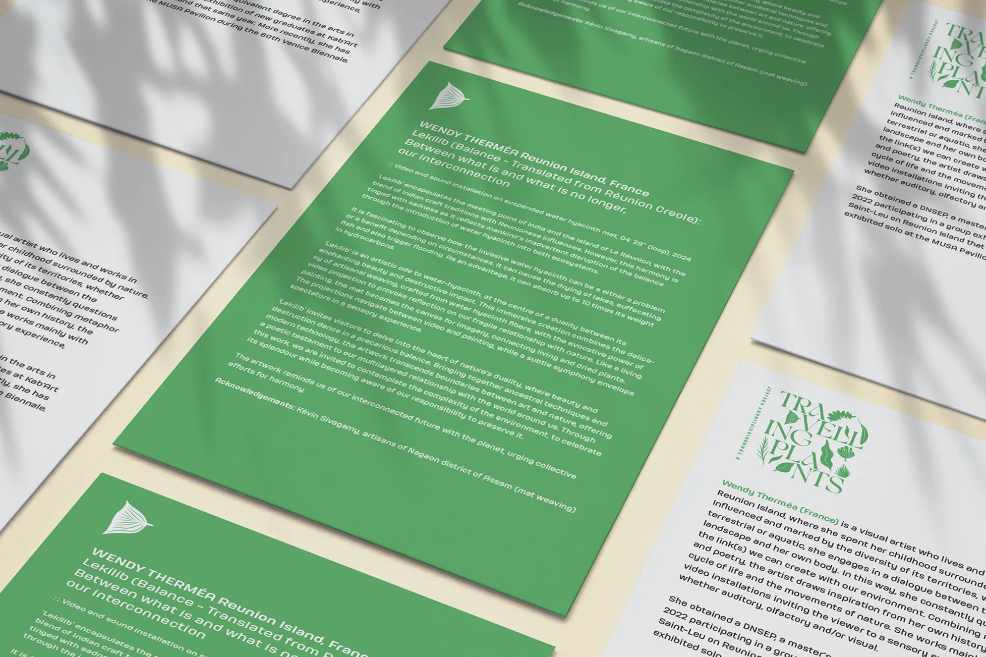 Green informational panels and brochures displaying project details and botanical content for the Travelling Plants exhibition